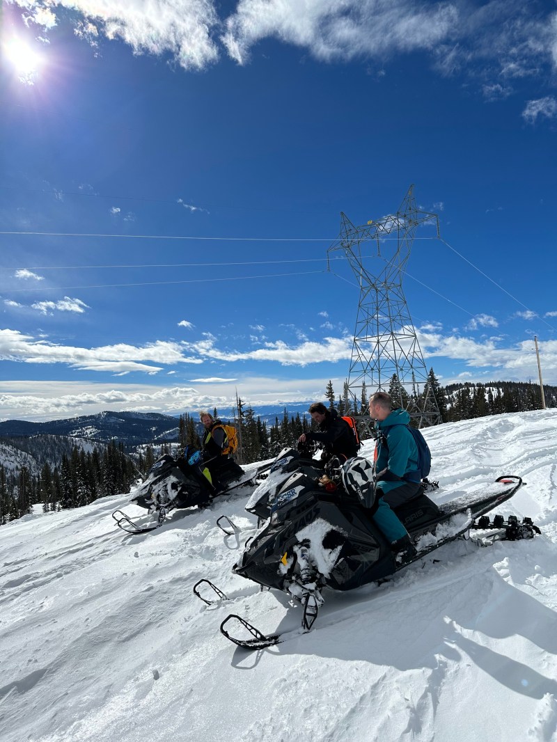 Three snowmobilers riding open terrain near Kremmling