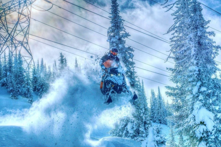 a person riding skis down a snow covered slope