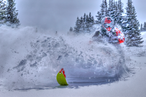 a person flying through the air while riding skis