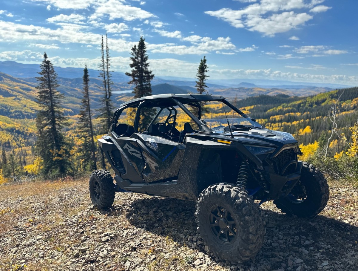 a truck with a mountain in the background