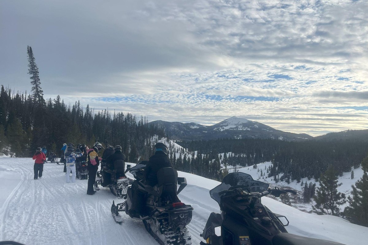 Larger snowmobile group riding near Steamboat Springs